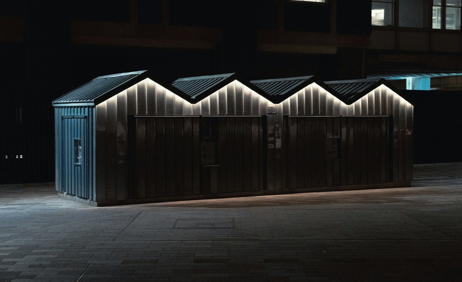 Outdoor entertaining area lit after dark, shown as it looks in daylight